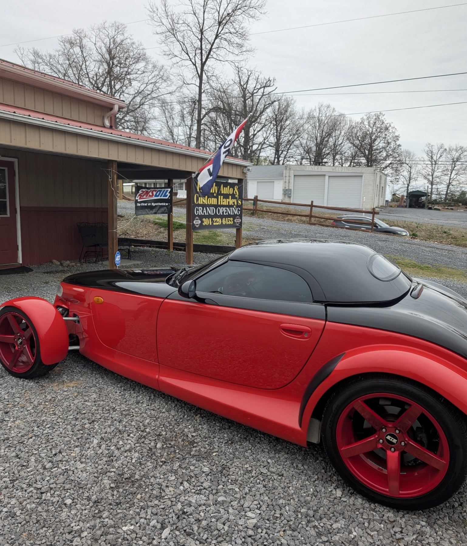 Red custom vehicle photographed at Russo's Auto Group